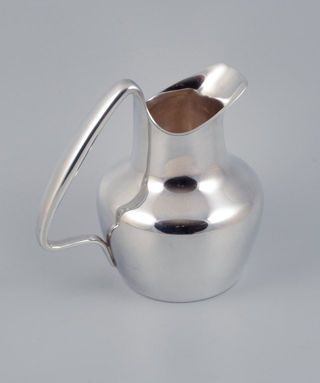 Henning Koppel for Georg Jensen, rare jug in sterling silver.: Title:Henning Koppel for Georg Jensen, rare jug in sterling silver. Description:Henning Koppel for Georg Jensen, rare jug in sterling silver. 1960s. Modernist design. Model number 1016. Marked. Perfec