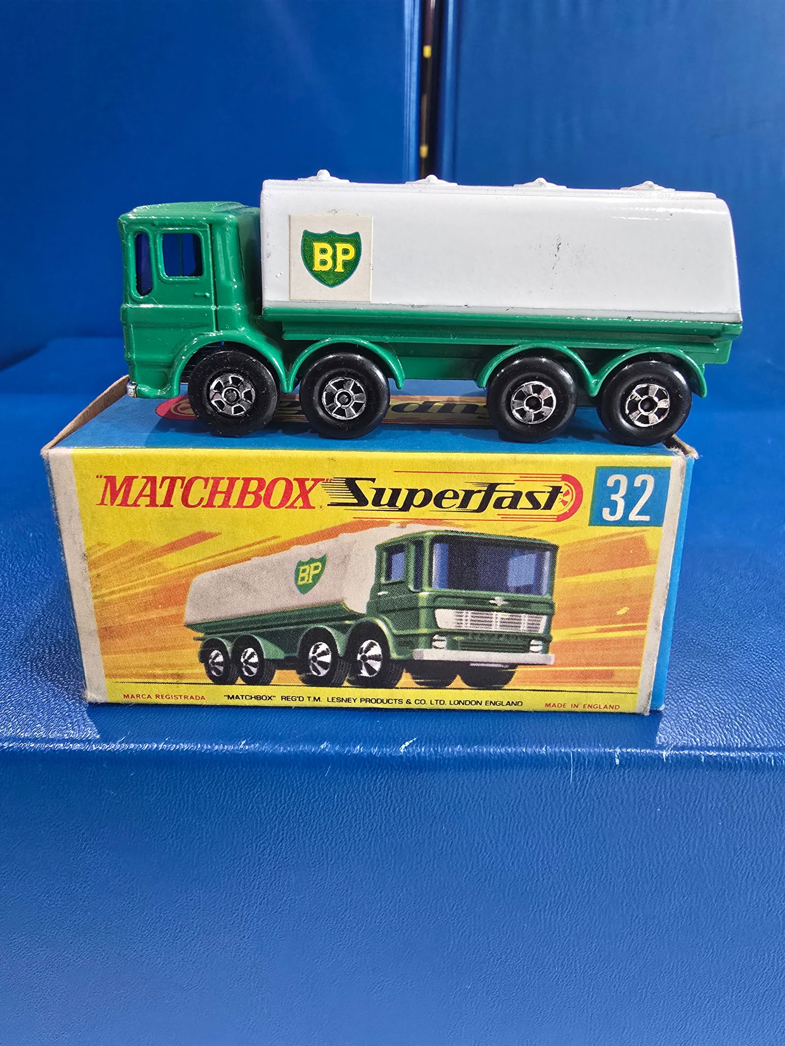#32, Transitional BP Tanker, Green body, blue glass, crome England base, bck axel clipp, tow hook: Title: Matchbox Superfast - G BoxDescription: #32, Transitional BP Tanker, Green body, blue glass, crome England base, bck axel clipp, tow hookDate/Period: 1970.sMaterials: MetalDimensions: 1/64 Reser