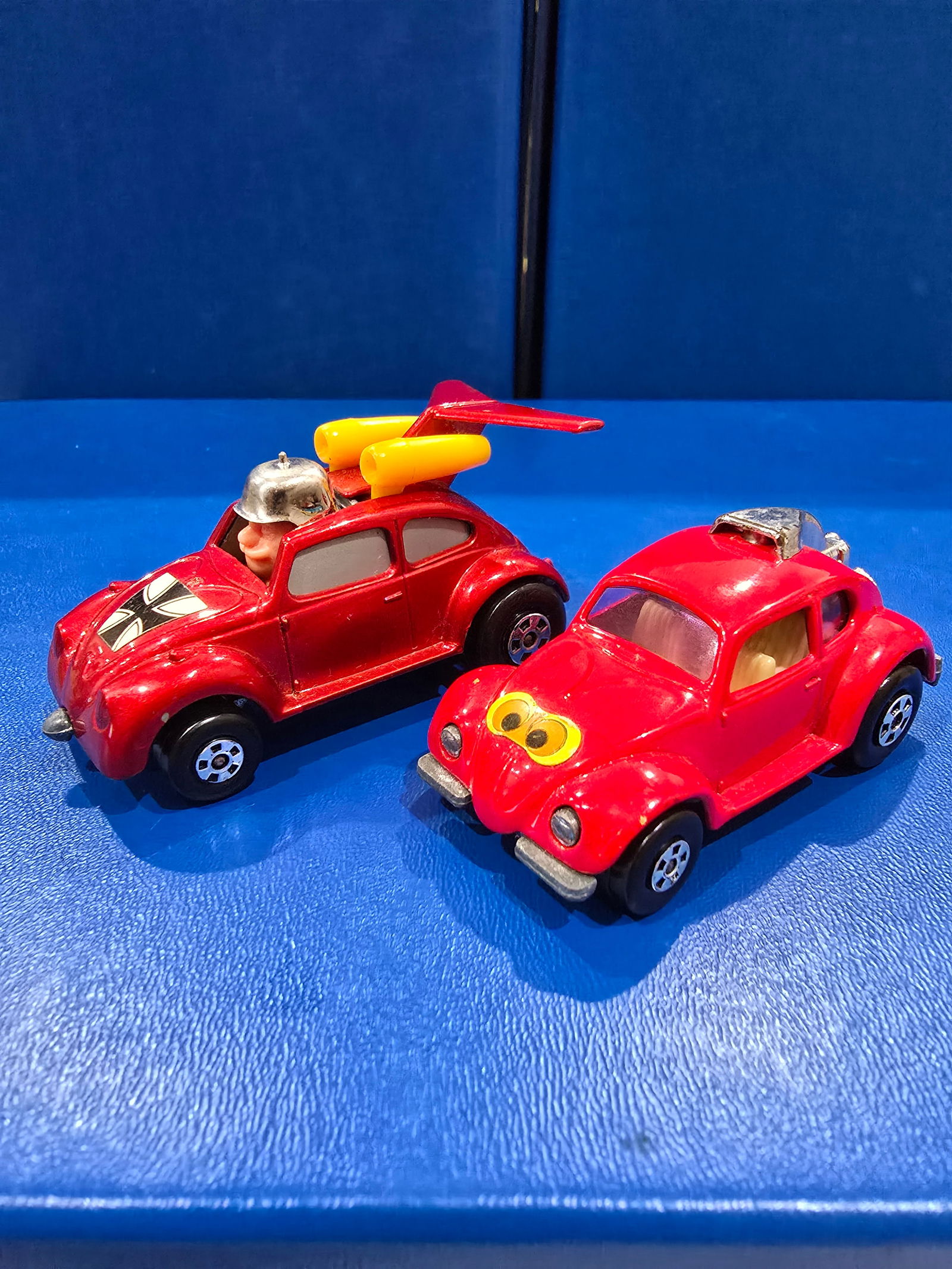 Both red, silver unpainted bases, purple windows Volks Dragon, silver windows flying Bug: Title: Matchbox Superfast Volks Dragon & Flying BugDescription: Both red, silver unpainted bases, purple windows Volks Dragon, silver windows flying BugDate/Period: 1971/1972Materials: metal Dimension