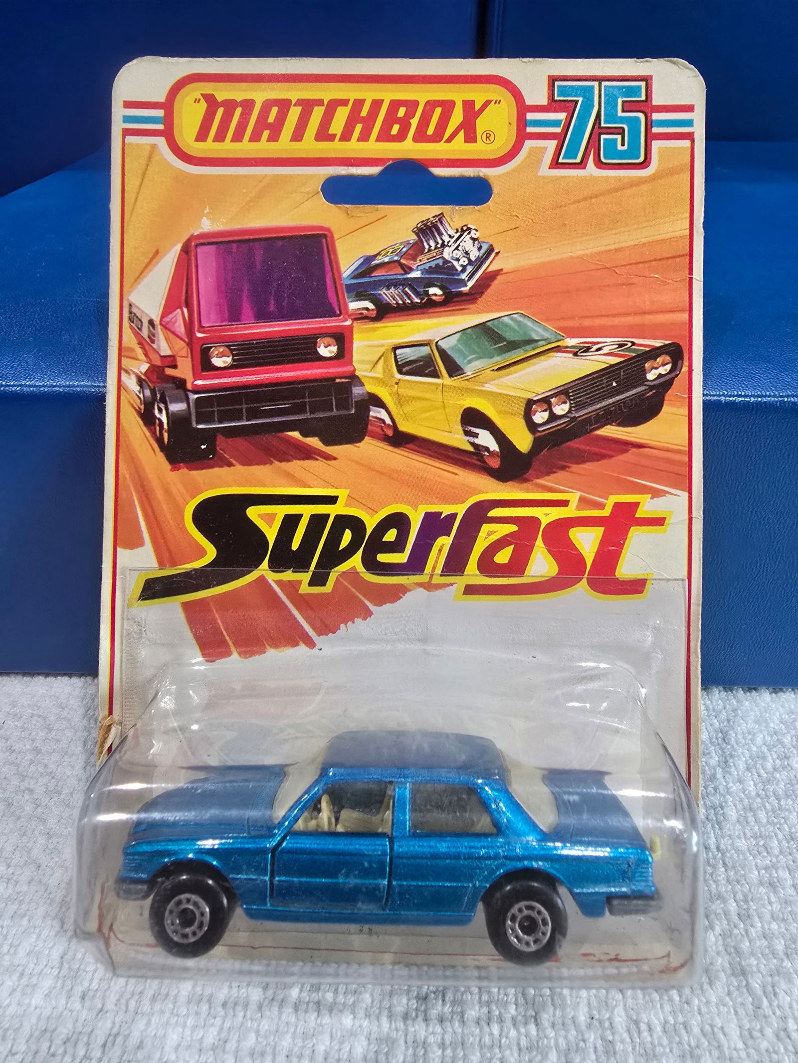 #56 Mercedes 450 SL, metalic blue, silver unpainted base, clear glass, tan interior: Title: Matchbox Superfast BlisterDescription: #56 Mercedes 450 SL, metalic blue, silver unpainted base, clear glass, tan interiorDate/Period: 1976Materials: MetalDimensions: 1/64 Reserve: $10.00 Shi