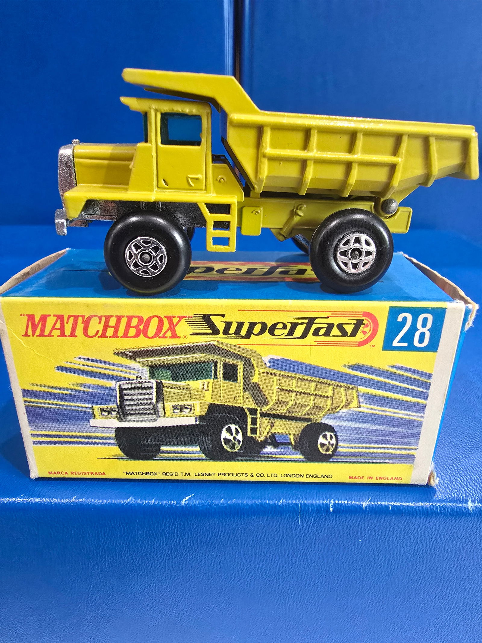 #28 Mack Dump Truck, pea green, blue glass, body silver unpainted England base, black axel clips (1 of 4)