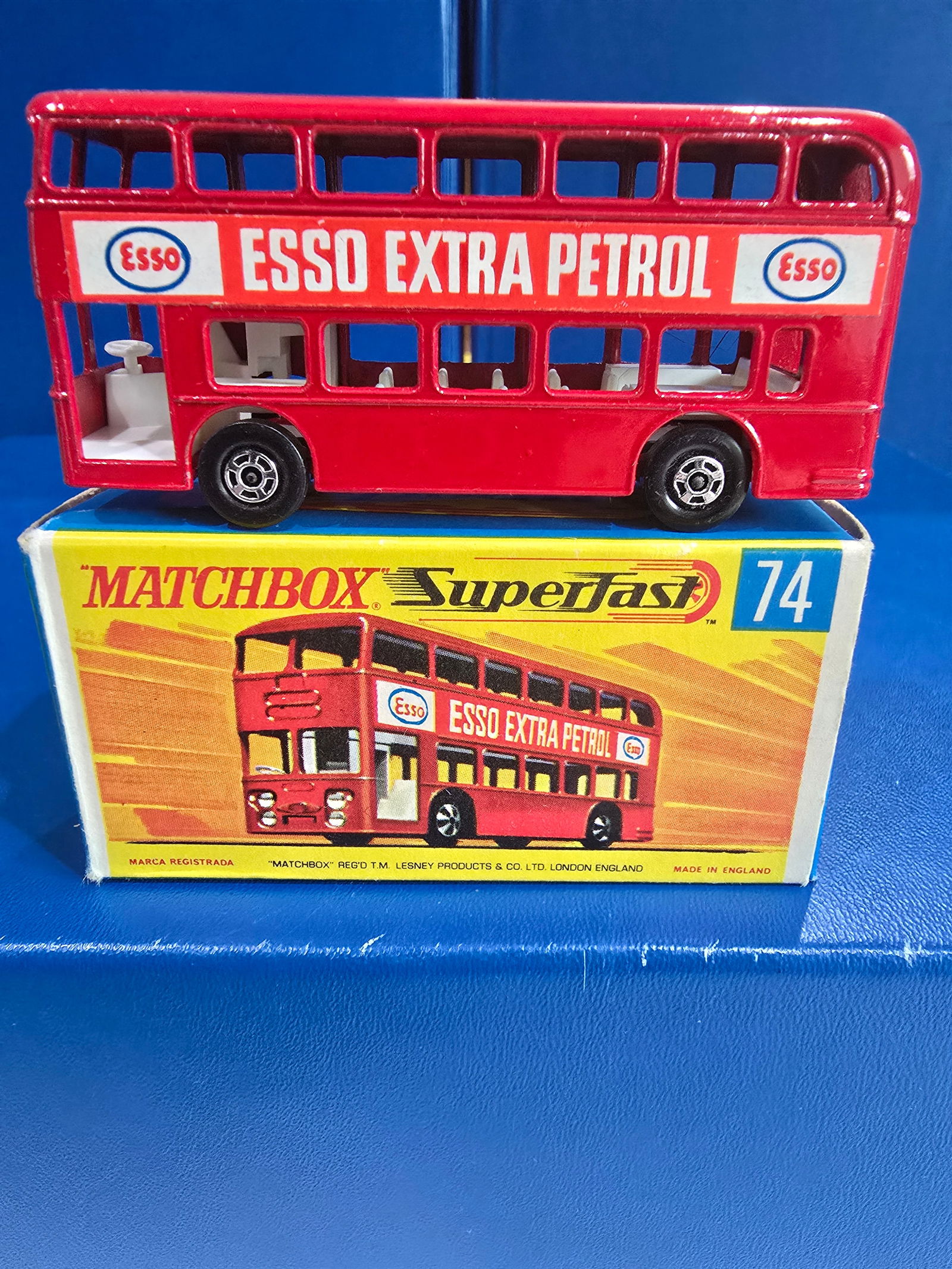 #39, England silver unpainted base, metallic red, white interior, clear glass: Title: Matchbox 75 SeriesDescription: #39, England silver unpainted base, metallic red, white interior, clear glassDate/Period: 1979Materials: MetalDimensions: 1/64 Reserve: $10.00 Shipping:
