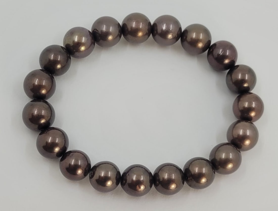 Bracelet 9x10.5mm Chocolate Tahitian Pearls: Title:Bracelet 9x10.5mm Chocolate Tahitian Pearls Description:This exceptional bracelet features chocoloate brown Tahitian pearls.. Each pearl is meticulously matched by attributes such as size, shade