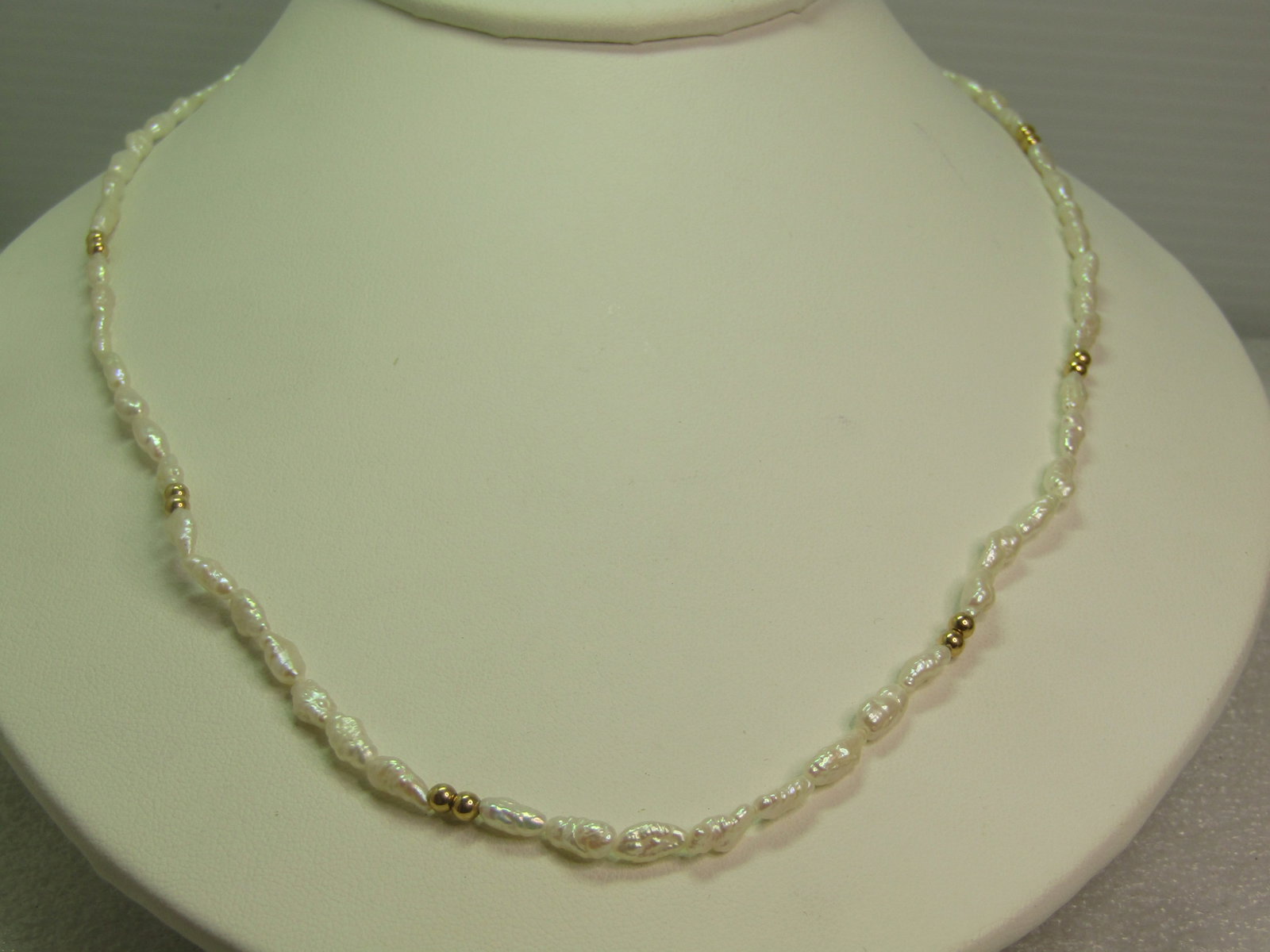 Vintage 14kt Freshwater Pearl Necklace, Gold Beads/Clasp, 19.5", 1980's-1990's: Vintage 14kt Freshwater Pearl Necklace, Gold Beads/Clasp, 19.5", 1980's-1990's. This has a 14kt filigree cateye shaped box clasp and twelve 2mm 14kt gold beads. The freshwater pearls are an average of