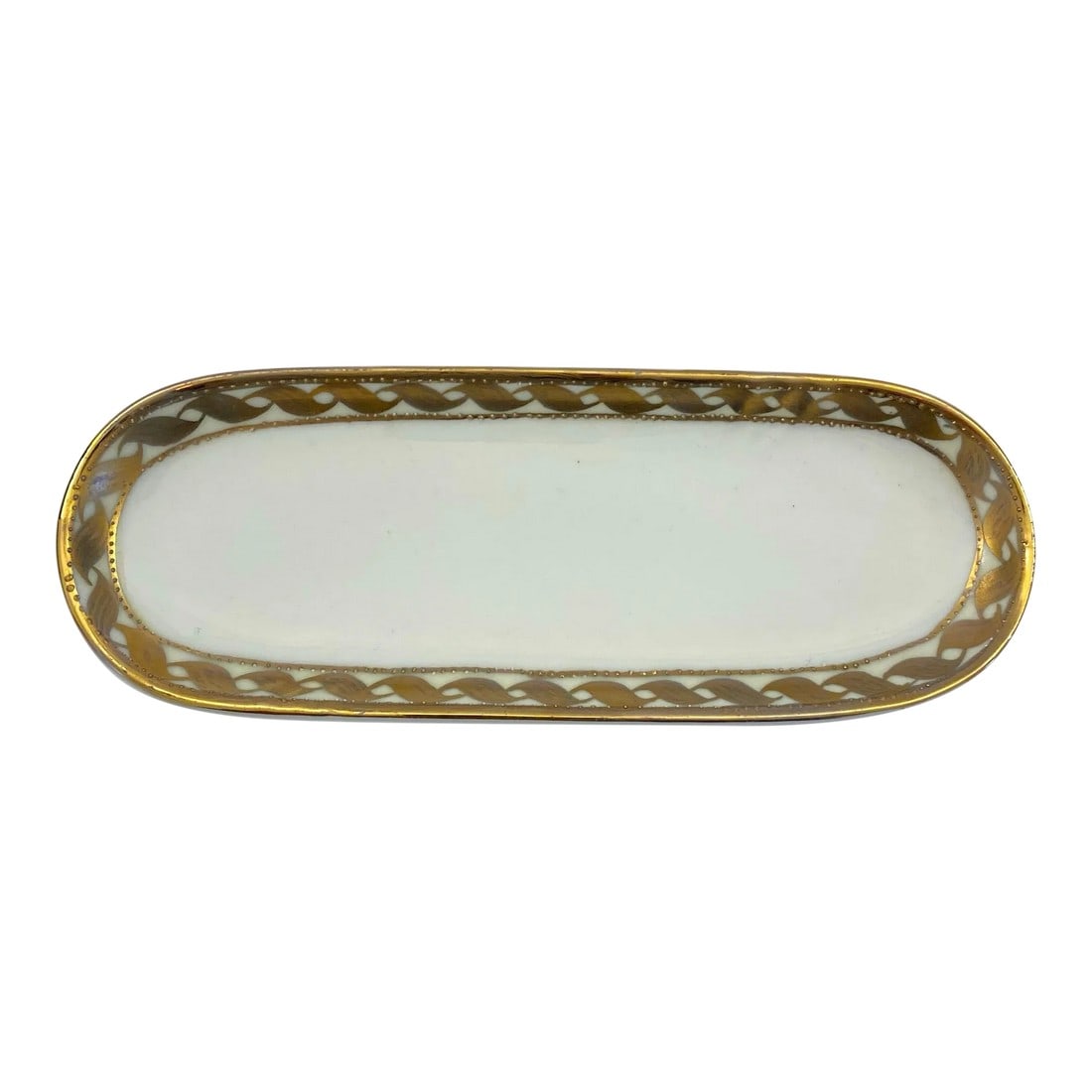 Vintage 1960s Hand Painted Gilded Porcelain Nippon Oblong Trinket Dish: Beautiful hand painted white and gilded porcelain Japanese Nippon trinket dish from the 1960s. Interlocking leaves punctuated by raised dots. Outer rim gild is in very good condition with minimal sign
