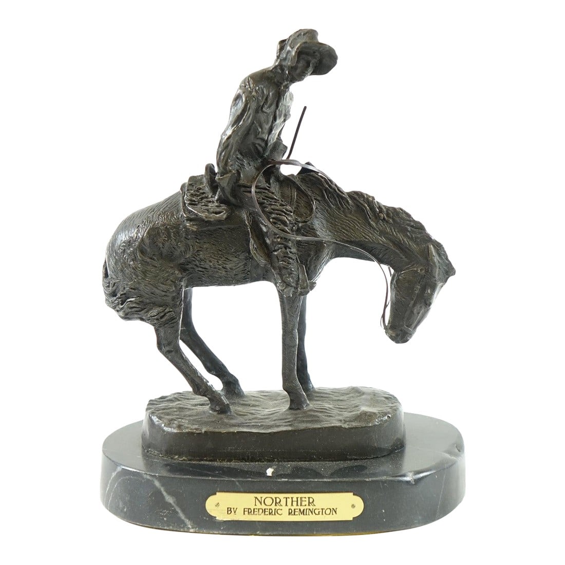 Late 20th Century Frederic Remington "The Norther" "“ Large Bronze Sculpture of Horse and: This stunning large bronze sculpture by renowned American artist Frederic Remington, titled The Norther, captures the dynamic energy of a cowboy riding through a fierce, wintry storm. The detailed ren