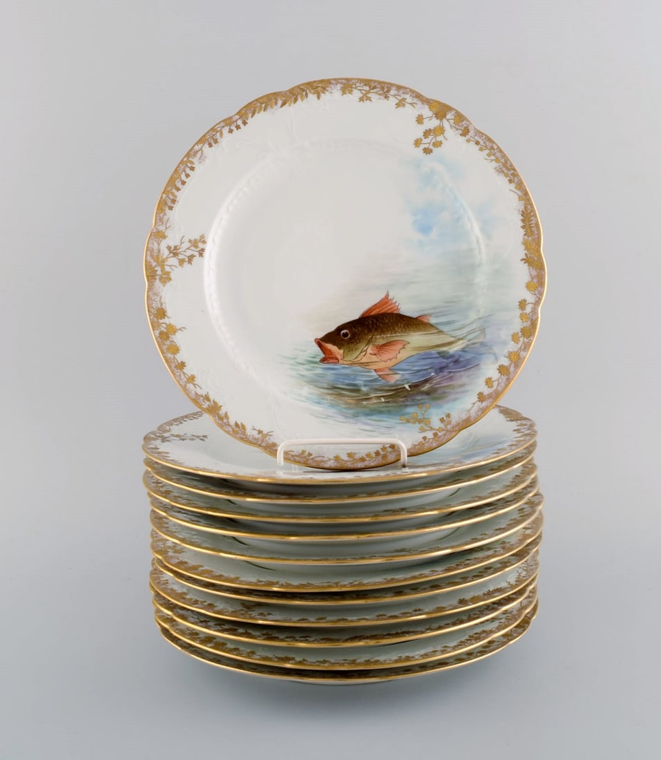 Twelve antique Pirkenhammer porcelain dinner plates with hand-painted fish and gold decoration. High: Twelve antique Pirkenhammer porcelain dinner plates with hand-painted fish and gold decoration. High quality, early 1900s. Diameter: 24.5 cm. In excellent condition. Stamped. Reserve: $819.00 Shipping