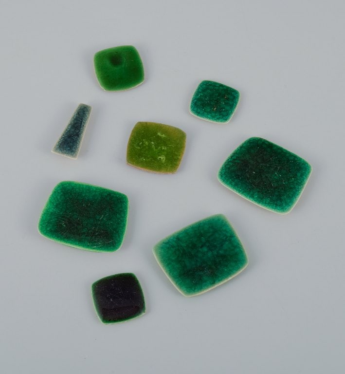 Ole Bjørn Krüger (1922-2007), Danish sculptor and ceramicist. Eight unique brooches in: Ole Bjørn Krüger (1922-2007), Danish sculptor and ceramicist. Eight unique brooches in glazed stoneware in shades of green. 1960s/70s. In excellent condition. Partially stamped "Denmark". Pr