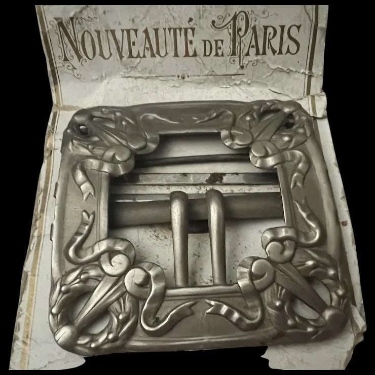 Antique Paris France Art Nouveau Belt Buckle: Antique Paris France Art Nouveau Belt Buckle still on original stock card made of tin metal. Shipping: Domestic: Flat-rate of $5.00 to anywhere within the contiguous U.S. International: Foreign shippi