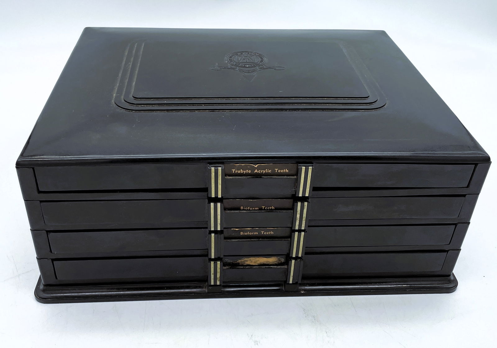 1940's The Dentists' Supply Co. of New York Bioform False Teeth Bakelite Cabinet: Title: 1940's The Dentists' Supply Co. of New York Bioform False Teeth Bakelite Cabinet Date/Period: Approx. 1940's Dimension: Approx. 15" x 12" x 6" Material: bakelite Additional Information: This vi