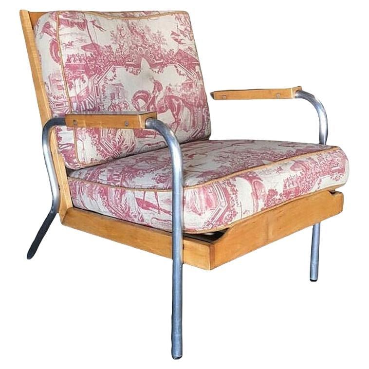 Mid-Century Francois Caruelle Style Blonde Lounge Tubular Chair, 2 Available: Unique blonde Mid-Century hardwood lounge chair with chromed round tubular steel legs featuring much of the styling made famous by Francois Caruelle. Sale for 1 chair, 2 chairs available Dimensions: H