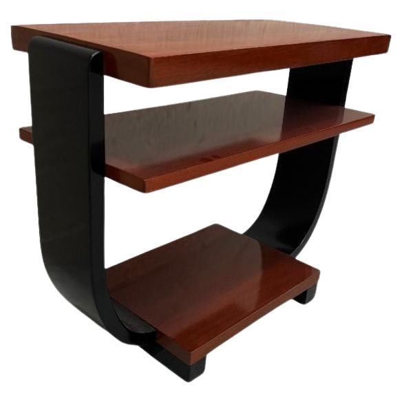 Two-Tone Geometric Art Deco Side Table by Gilbert Rohde for Brown Saltman: Two-tone, two-tier Art Deco side table made of Pearwood. Fantastic side profile with a great geometric round Cantaleviered Stacking table, and curio display for any small decorative items. The table w