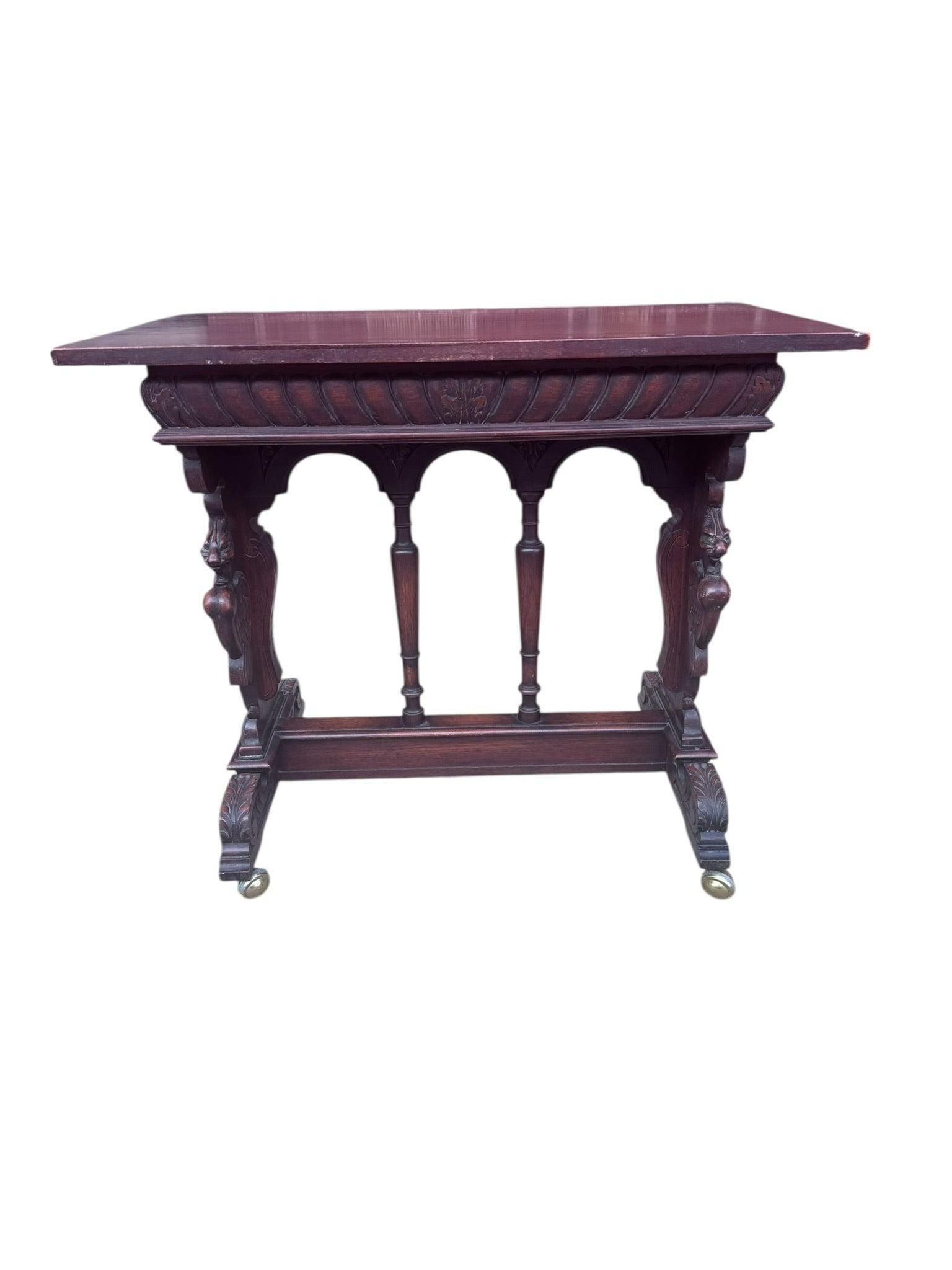 Antique Italian Renaissance Revival Carved Ornate Figural Console Table: Vintage from before 2000 Antique Italian Renaissance Revival carved Ornate Figural Bust, Winged Lions Head and Cherub Detailed Walnut Console Table The sides of this Renaissance revival console table