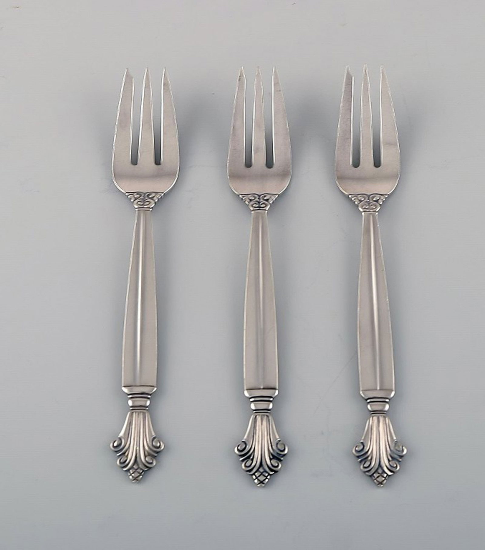 Johan Rohde for Georg Jensen. Three early Acanthus pastry forks in sterling silver. Dated 1915-30.: Title:Johan Rohde for Georg Jensen. Three early Acanthus pastry forks in sterling silver. Dated 1915-30. Description:Johan Rohde for Georg Jensen. Three early Acanthus pastry forks in sterling silver.