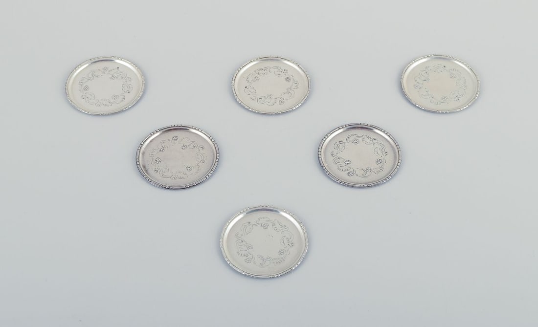 Georg Jensen, a set of six glass coasters in sterling silver.: Title:Georg Jensen, a set of six glass coasters in sterling silver. Description:Georg Jensen, a set of six glass coasters in sterling silver. Model number 51A. Stamped with the hallmark from 1915-1932