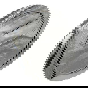 Early 20th Century Tiffany and Co. Table Mirror: This Tiffany & Co. mirror features a sleek, round design with a highly reflective, polished silver-tone frame. The craftsmanship is evident in the smooth, elegant finish, making it both a functional