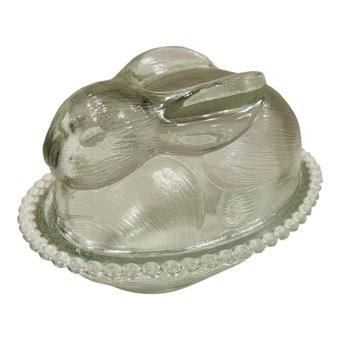Vintage Oval Glass Bunny Dish by Indiana Glass Company: Charming Indiana Glass bunny on nest candy dish. Sweet Bunny with laid back ears lying on a beaded dish or nest. This cute clear glass rabbit dish could be used for candy, dips, crackers or trinkets.