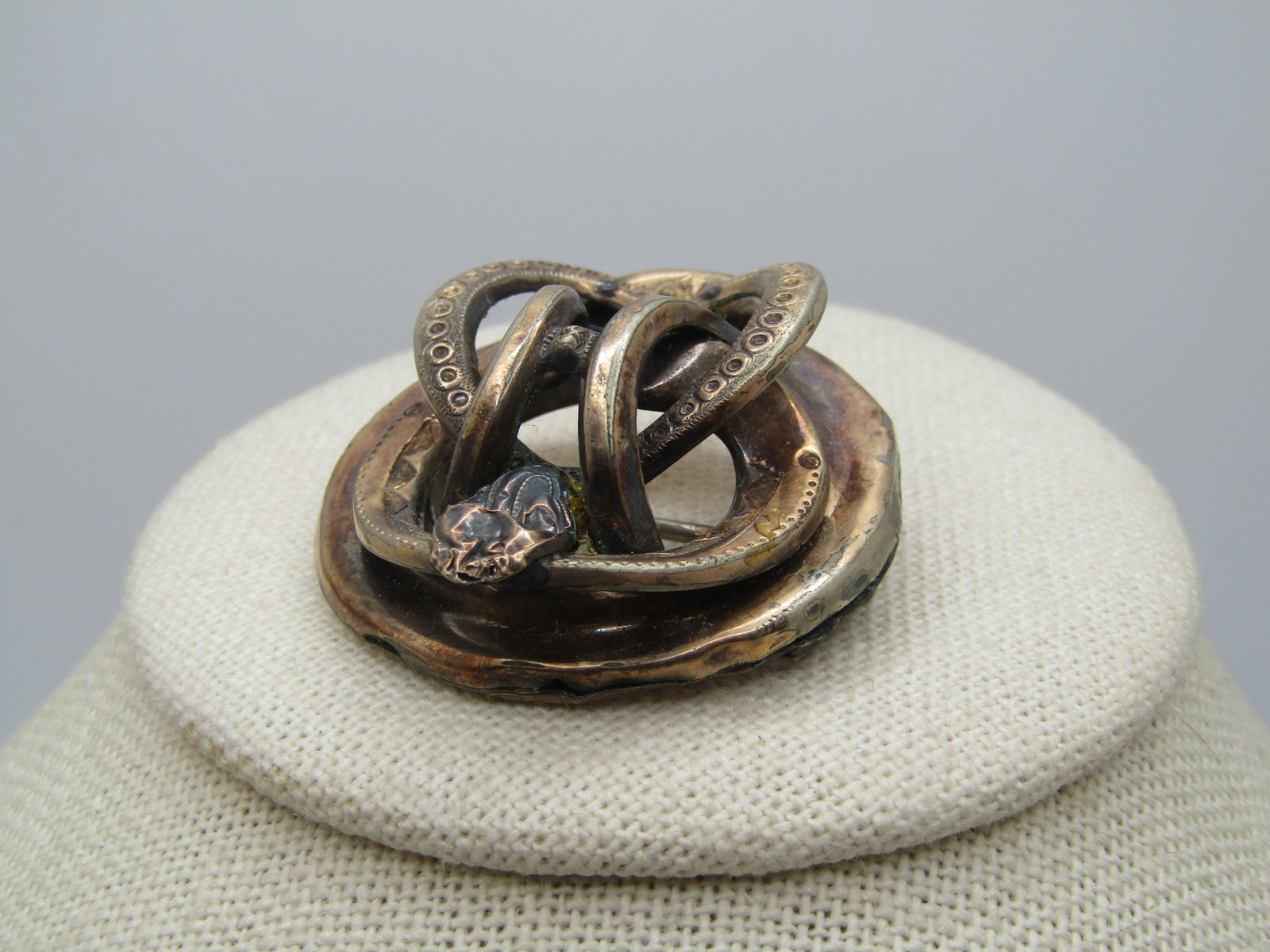Victorian Interwoven 10kt G.F. Snake Brooch, C-Clasp,: Victorian Interwoven 10kt G.F. Snake Brooch, C-Clasp. The snake is basically a round design with tiered and twists. It is appx. 1.5" wide. It tests as 10kt gold filled with a weight of appx. 8.66 gr. 
