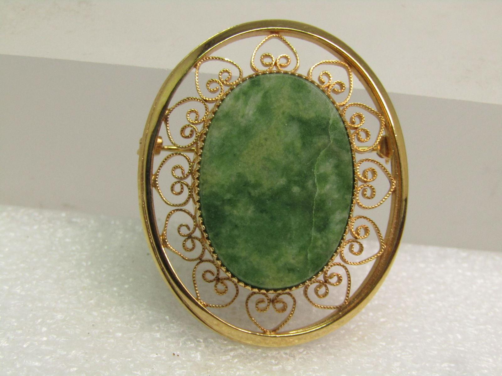 Vintage 12kt G.F. Green Agate Brooch, Heart Scrolled, 1970's, Signed: Vintage 12kt G.F. Green Agate Brooch, Heart Scrolled, 1970's, Signed with what looks like a maker's mark before the 1/20 12kt G.F. marking but it cannot be made out. The brooch is oval and appx. 1.5"