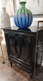 Modern designer deco-style black lacquer cabinet w/ pop-open glass door & bottom drawer. 24w x 18.5