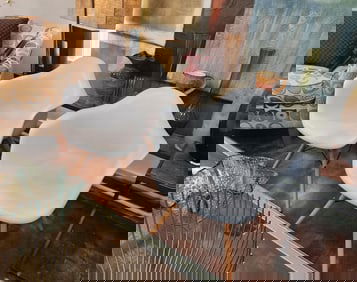 Pair of Designer mid-century modern Eames Breur polyurethane molded side chairs