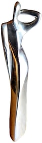 Vintage polished metal sculpture featuring an elegant lady of the 20th century Deco era.
