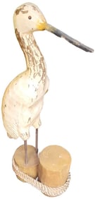 Wonderful wood carved of a crane or heron perched on a roped footing