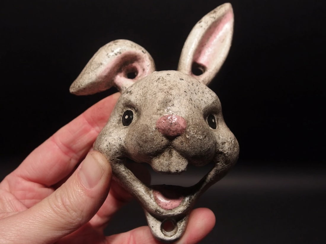 Cast Iron folk art Rabbit Wall mount Bottle Opener: 5 3/4" Tall x 4" Wide Great reproduction cast iron bottle opener. This piece was made to look just like an antique, but is new. Reserve: $15.00 Shipping: Domestic: Flat-rate of $6.00 to anyw