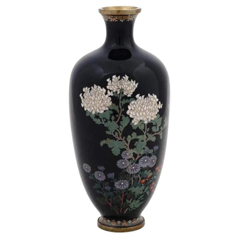 High Quality Antique Meiji Japanese Cloisonne Enamel Vase With Hydrangea's Hayas: A high quality antique Japanese late Meiji period enamel over brass vase. The vase has an amphora shaped body and a fluted neck. The ware is enameled with a polychrome image of blossoming flowers on t