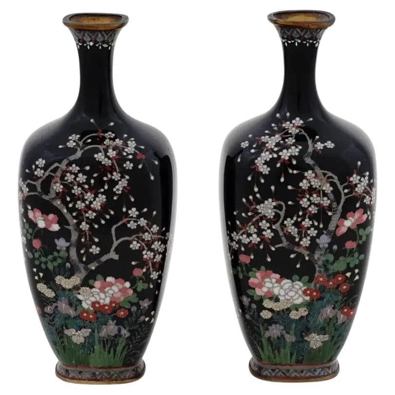 Pair of Antique Meiji Japanese Cloisonne Silver Wire Enamel Vases Blossoming Gar: A pair of antique Japanese, late Meiji period, silver wire enamel vases. Each vase has an amphora shaped body and a fluted neck. The wares are enameled with a polychrome image of a pair of birds in sa