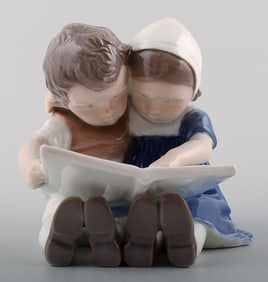 1567 Bing & Grondahl ,b&g, Porcelain Figurine girl and boy reading.