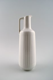 German jug in white porcelain, modern design, fluted.