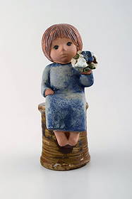 Lisa Larson for Gustavsberg. Rare stoneware figure. Girl with flowers.: Lisa Larson for Gustavsberg. Rare stoneware figure. Girl with flowers. Measures: 22,5 cm x 12 cm. In perfect condition. Signed. Reserve: $469.00 Shipping: Domestic: Shipping rates are determined by d