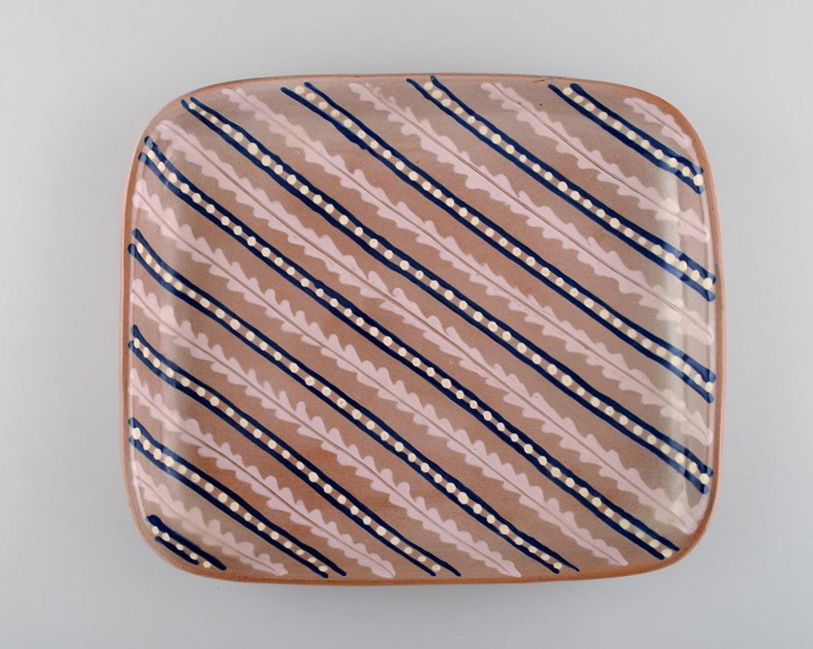Anna-Lisa Thomson for Upsala-Ekeby. Large dish in glazed stoneware. Striped design. Mid-20th: Anna-Lisa Thomson for Upsala-Ekeby. Large dish in glazed stoneware. Striped design. Mid-20th century. In very good condition. Measures: 30 x 25 cm. Stamped. Reserve: $210.00 Shipping: Domestic: Shipp