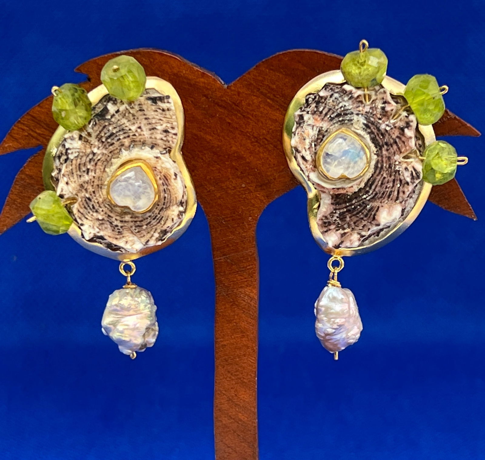 Delphinula and Peridot Earrings: Title:Delphinula and Peridot Earrings Description:Pair of fun, fabulous pink Delphinula shells with occluded Peridot and drops of exquisite, pink/gray Rosebud Pearls and moonstone hearts - 1.5" drop f
