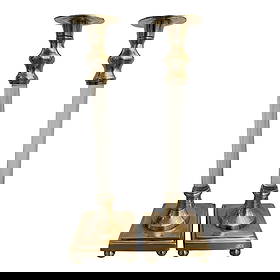 1970’s Hollywood Regency Lucite and Brass Candle Sticks - a Pair: This pair of solid brass and lucite candle holders are unusual in that the base is stepped and sits on 4 ball feet. The center is sparkling lucite topped with brass drip catchers for the taper candle