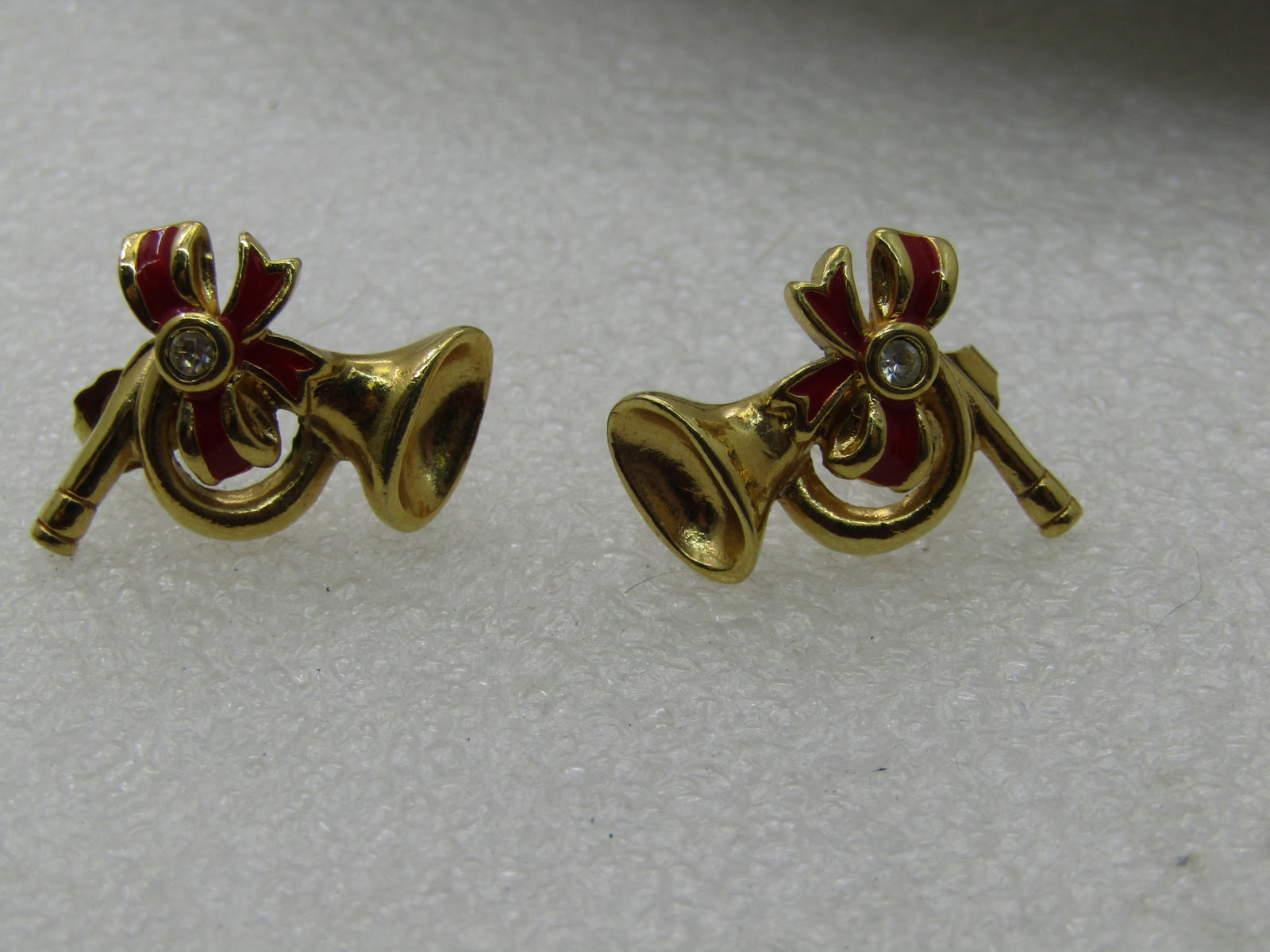 Vintage Avon Christmas Horn Earrings, Enameled, Pierced: Vintage Avon Christmas Horn Earrings, Enameled with Rhinestone, Pierced, 1", gold tone. Red enameled bow. Signed Avon. Appx. 1970's-1980's. Very good condition. (INV. W. 92817.2 SS2839 J LD 10/18/20) 