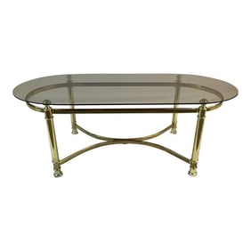 1980s Postmodern Brass Style Gold Chrome Metal Base Coffee Table With Smokey Oval Top.