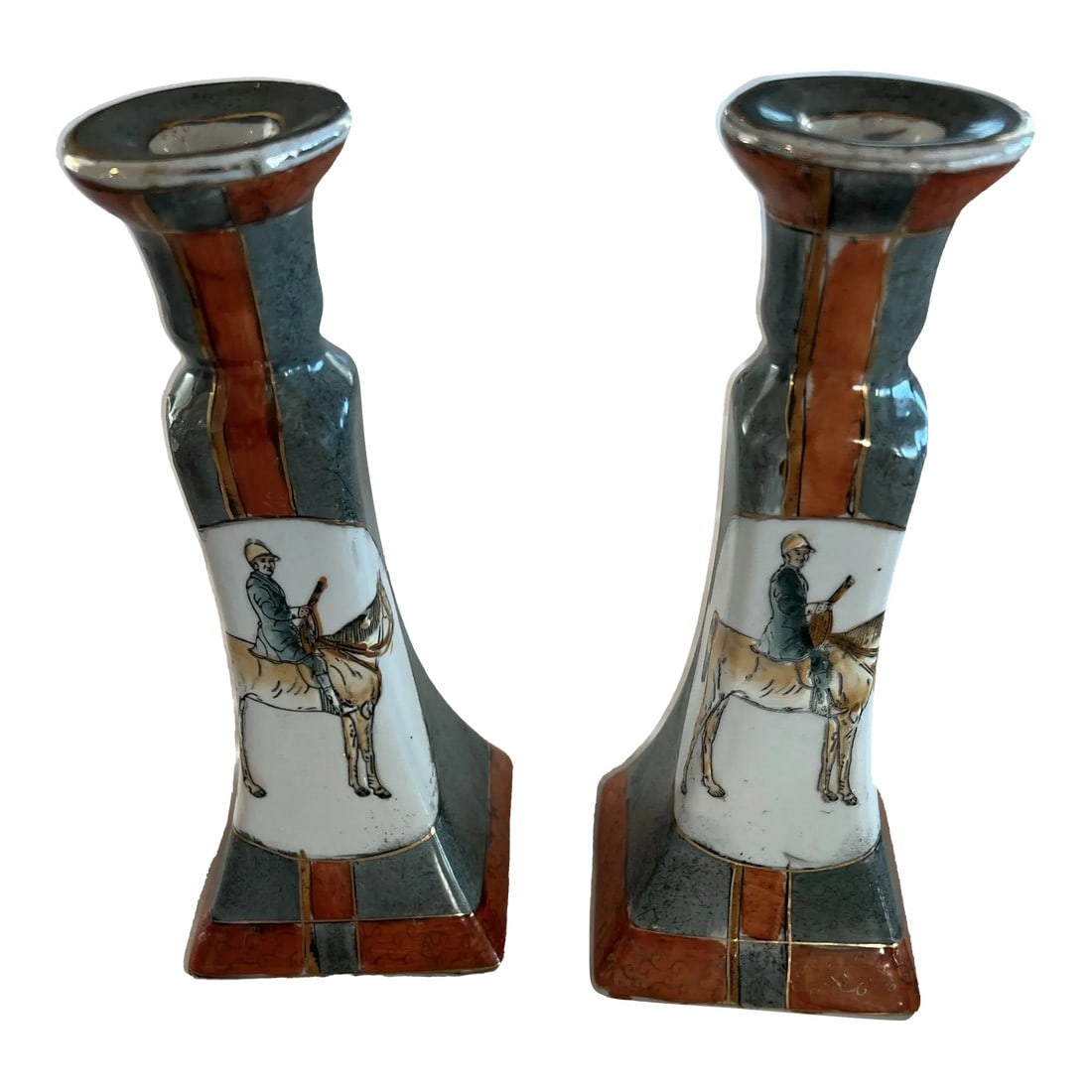 Equestrian Candlesticks in Burnt Orange and Gray a Pair: A pair of vintage candlesticks with an equestrian theme. Horse and rider proudly displayed on the front. There is gilt accents on the candlesticks as well. Please see pictures. Condition: Alterations: