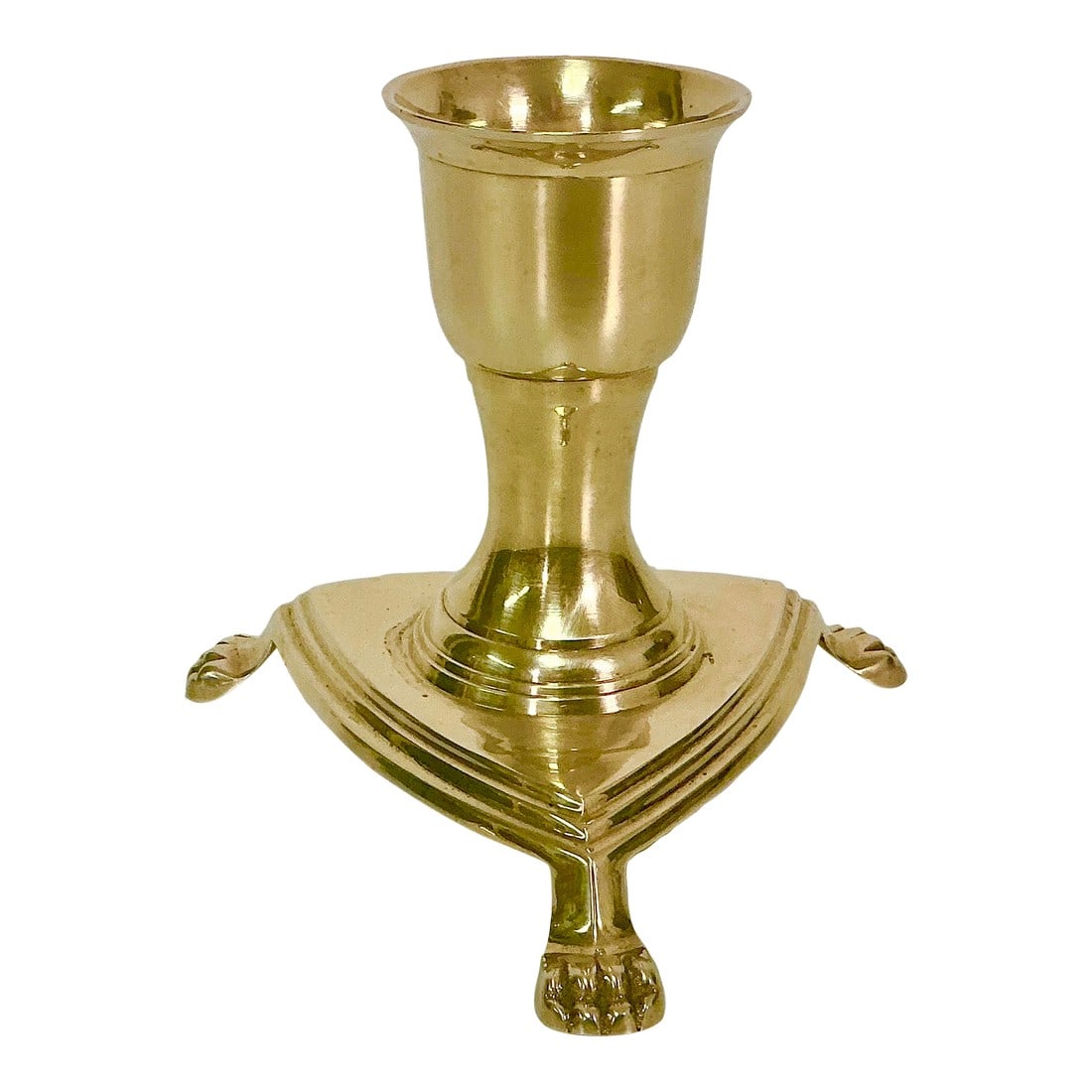 Mid-Century Hollywood Regency Paw-Footed Brass Candlestick Holder.: This is a lovely low-rise candlestick holder from the Mid-Century. The Hollywood Regency design features a triangular base with three footed paws. A great addition to a side table or console table. We