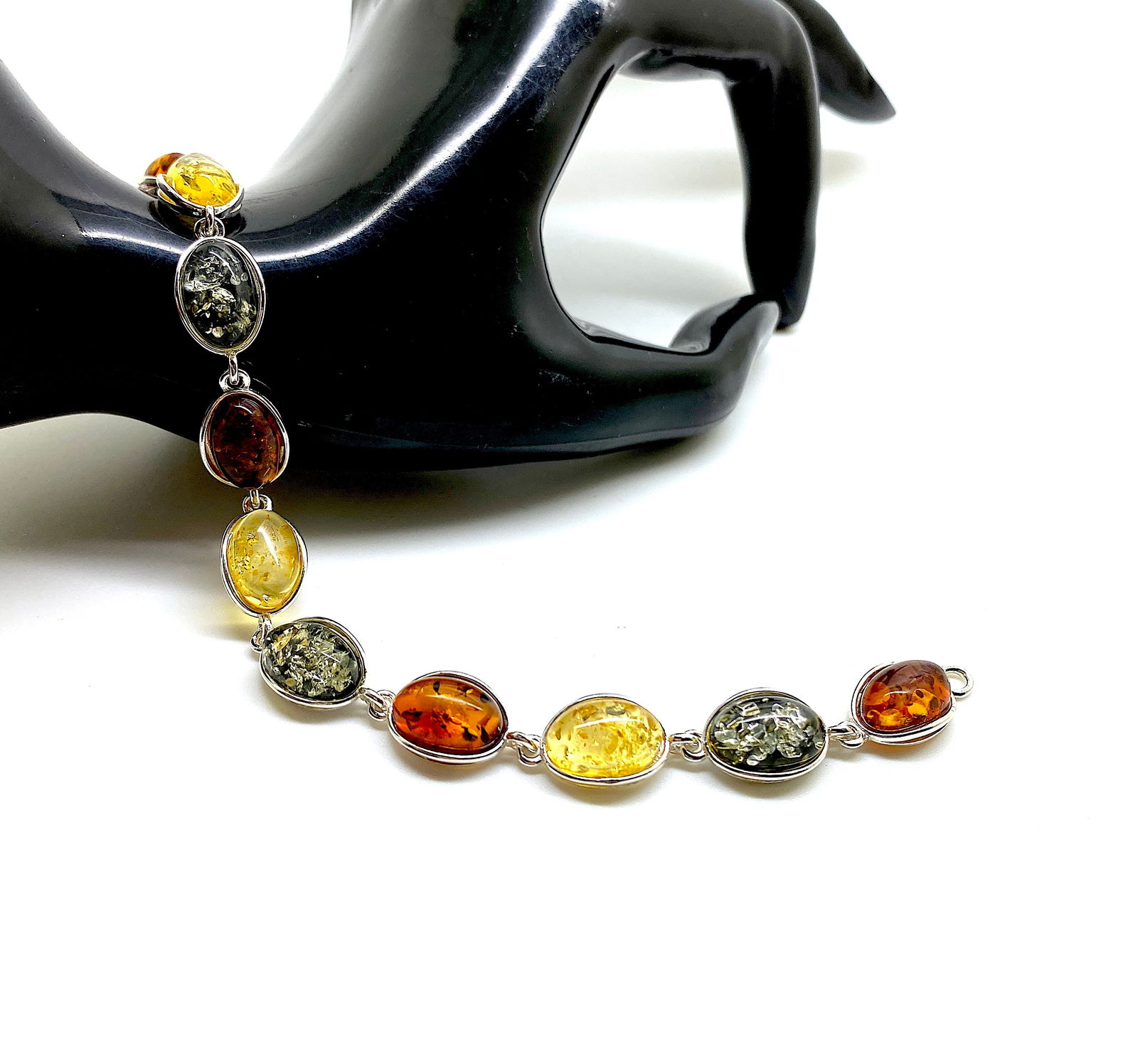 Incredible Amber Bracelet: Title:Incredible Amber Bracelet Metal:Sterling Silver Gemstone:Amber Weight:10.16 g Size:Size: 170.0 x 9.0 x 6.0 mm Size: 6.693 x 0.354 x 0.236 inches Made of:(Reconstituted Amber or Whole Stone):Whol