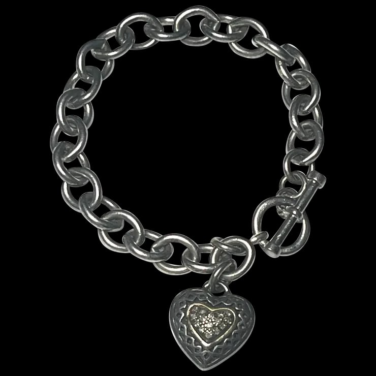 Estate Sterling Silver and 14k Diamond Heart Toggle Charm Bracelet: Title: Estate Sterling Silver and 14k Diamond Heart Toggle Charm Bracelet Description: Estate Sterling Silver and 14k Diamond Heart Toggle Charm Bracelet Hallmarked- 925 14k Thailand Weighs 27 grams w