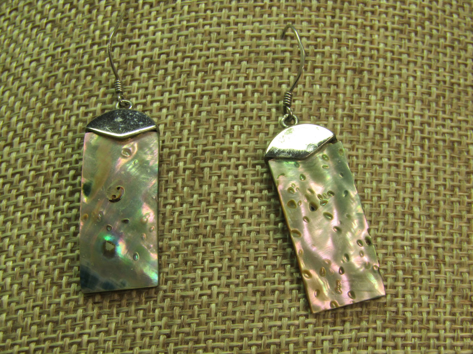 Vintage Sterling MOP/Abalone Drop Earrings, Pierced, 1990's: Vintage Sterling MOP/Abalone Drop Earrings, Pierced, 1990's. These have a round and angled sterling top with sterling hooks and a 1" by 1/2" piece of slightly curved abalone/mother-of-pearl drop set i