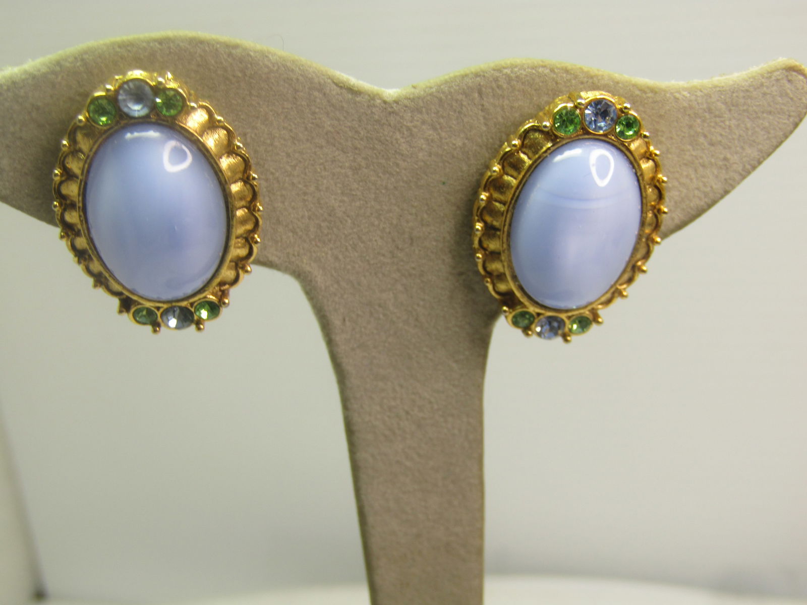 Vintage Glass Moonstone & Rhinestone Earrings, by 1928, 1980's: Vintage Glass Moonstone & Rhinestone Pierced Earrings, by 1928, 1980's. Gold tone. These have a large oval faux blue moonstone - glass with a frame with green and blue glass rhinestones on top and bot