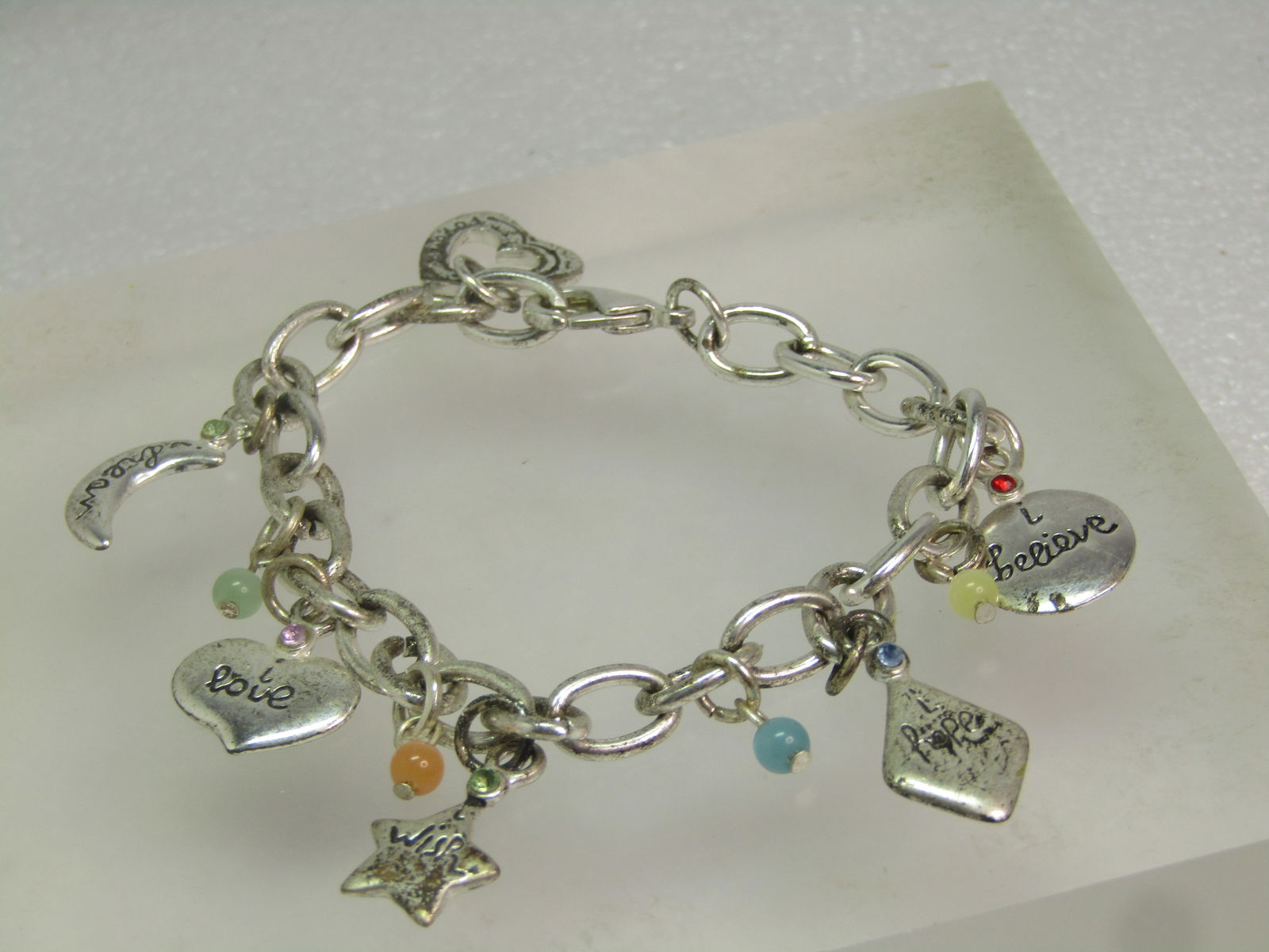 Vintage Inspirational Worded Charm Bracelet, 8", Heart Toggle, 1990's: Vintage Inspirational Worded Charm Bracelet, 8", Heart Toggle, 1990's. This is silver tone with am appx. 6.5mm wide oval-link bracelet with heavy lobster clasp and dangling charms that are: round; sta