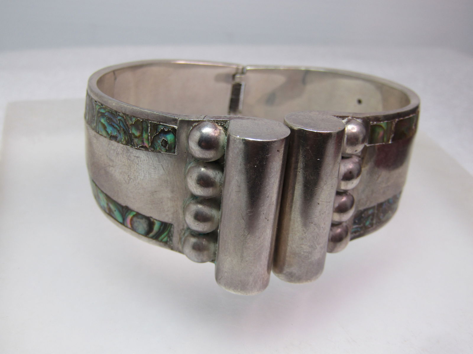 Vintage Sterling Hinged Abalone Cuff Bracelet Signed GAR, Taxco, Mexico, 6.5", 1950's-1970's: Vintage Sterling Hinged Abalone Cuff Bracelet Signed GAR, Taxco, Mexico, 6.5", 1960'-1970's. "GAR" on Taxco sterling jewelry typically indicates a silversmith named William Spratling. Spratling was a