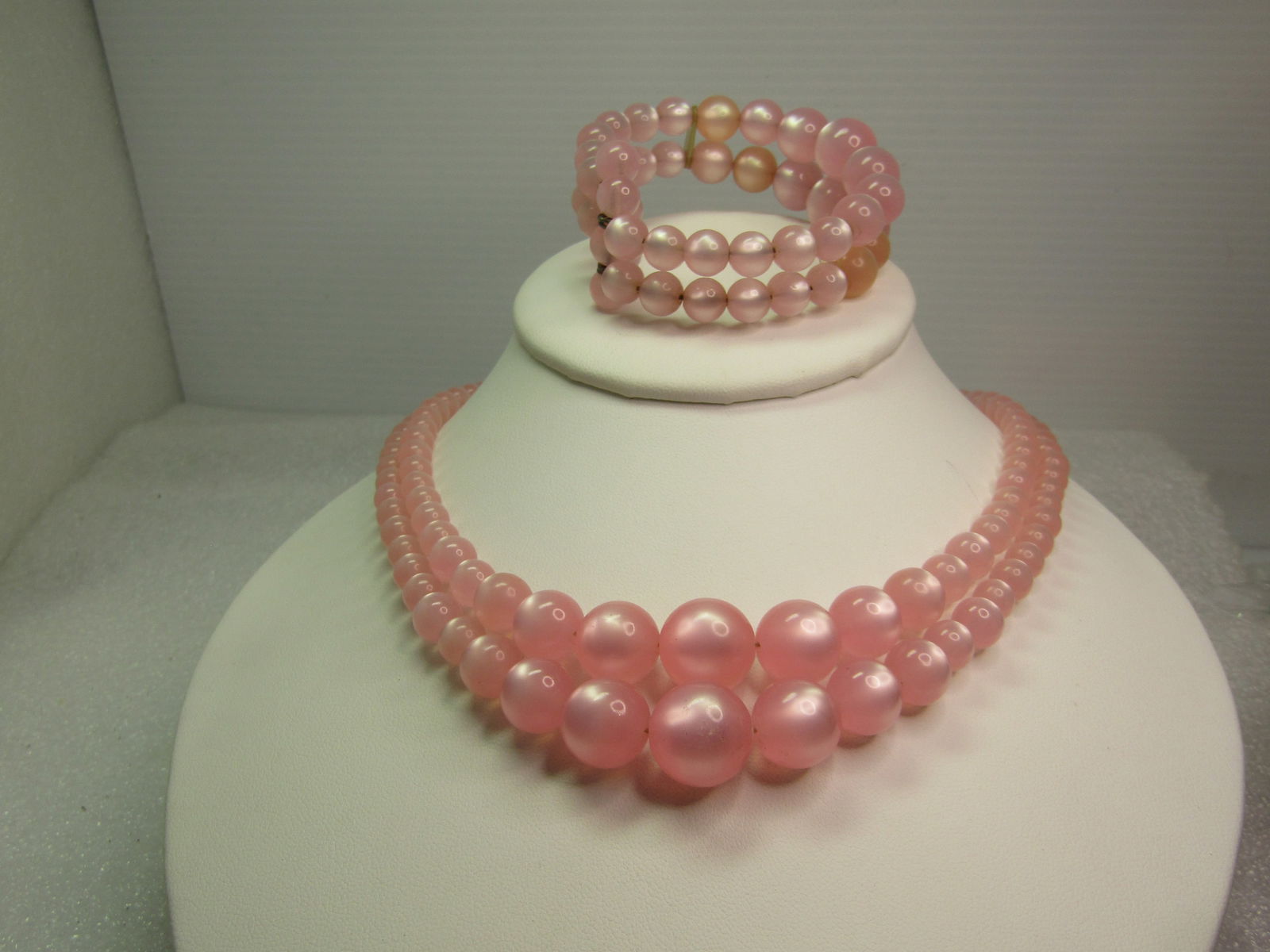 Vintage Necklace & Bracelet Set - mid-century, double strand pink faux moonstone necklace and coiled: Vintage Necklace & Bracelet Set - mid-century, double strand pink faux moonstone necklace and coiled cuff bracelet, silvertone ornate clasp. 16" long. Bracelet is 5.5" inside measurement but is meant