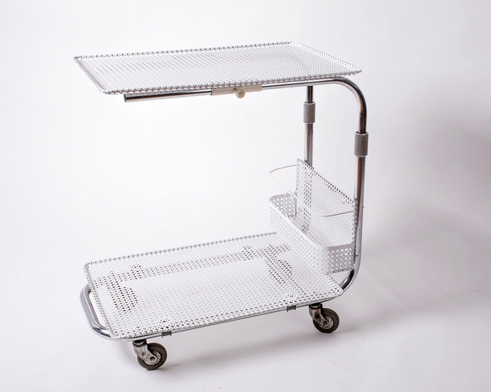 French mid century rolling cart trolley Mategot: French modernist rolling cart made in the 1950's by Mathieu Mategot , it is made with his trademark bent metal rigitulle adding awhimsical effect .He designed furniture and object for a short time , i