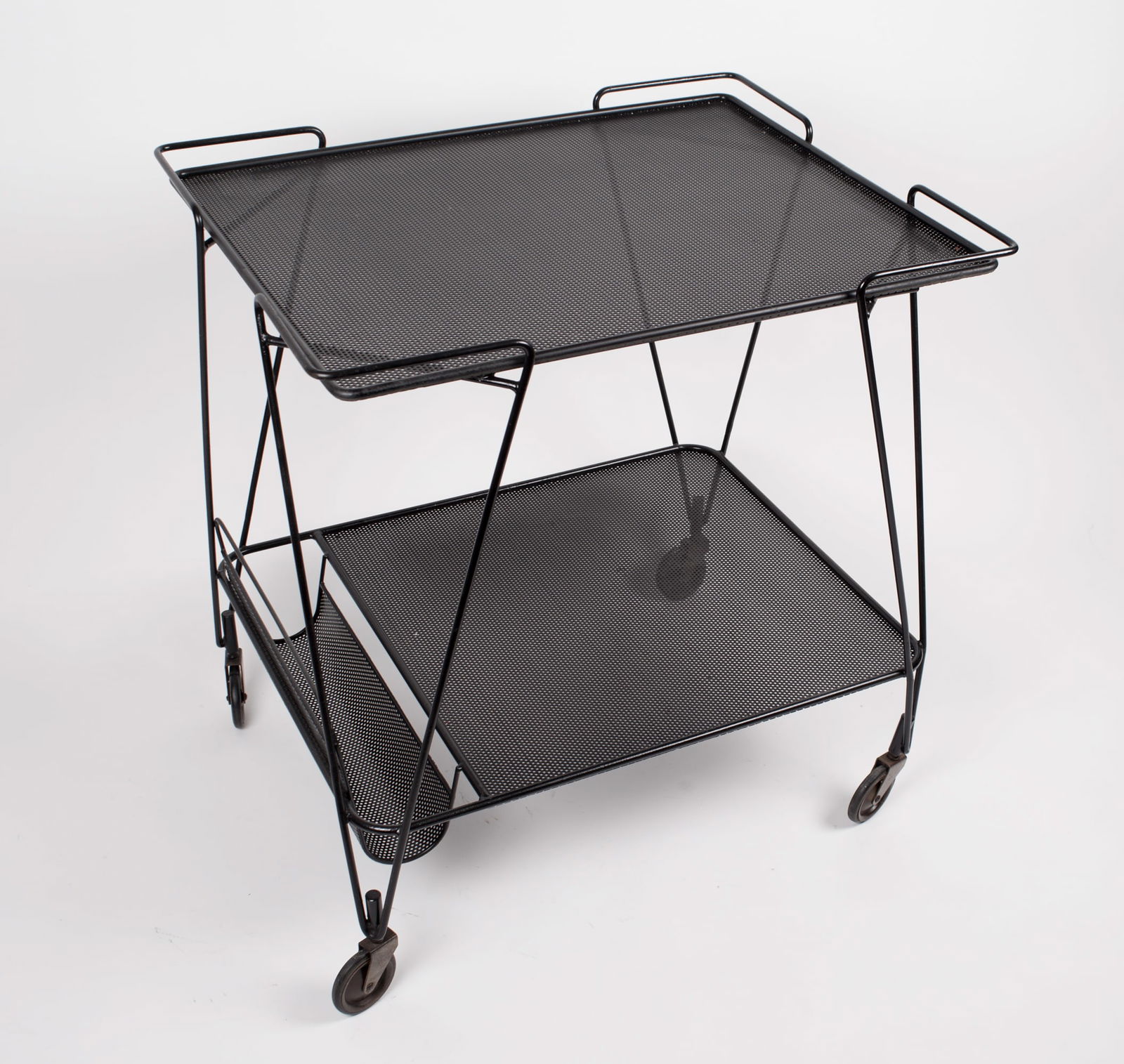 FRENCH MODERNIST Black serving table MATEGOT Mid century: Embark on a journey through French modernist design with this captivating trolley crafted in the 1950s by the legendary Mathieu Mategot. With his signature bent metal "rigitulle," the trolley exudes a