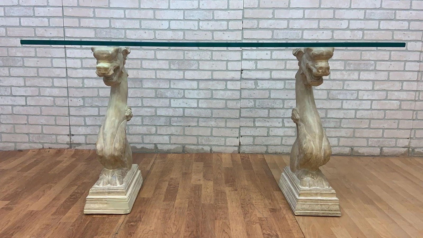 Vintage Hollywood Regency Asian Dragon Statue with Glass Top Console Table: Vintage from before 2000 Depth: 20 inches Width: 60 inches Vintage Hollywood Regency Asian Dragon Statue with Glass Top Console TableVintage console table has a rectangular glass pane top. The table i